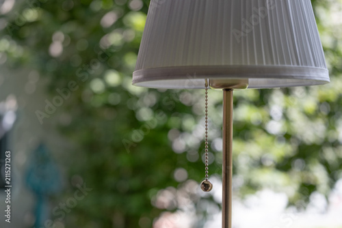 Photography Modern table lamp with soft natural background in cozy home interior