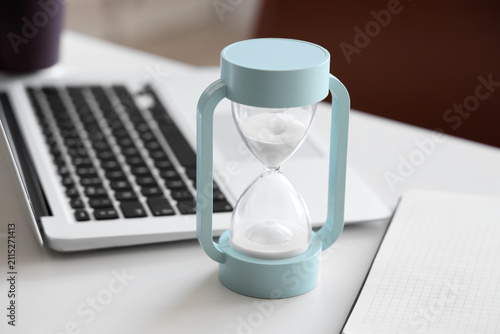 Hourglass on desk in office...