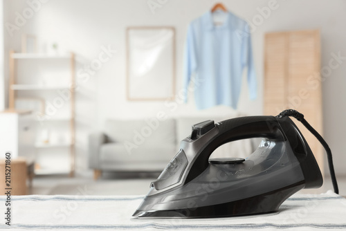 Black iron with towel on ta...