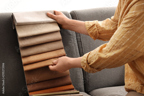 Woman with fabric samples o...