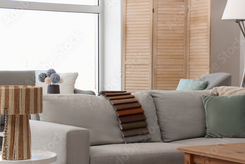 Grey couch with fabric samp...