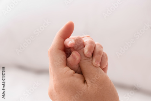 Woman holding her little ba...