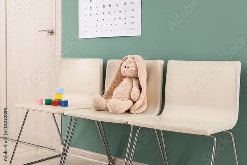 Toy bunny with cubes on cha...