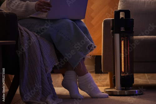 Young woman with laptop and...