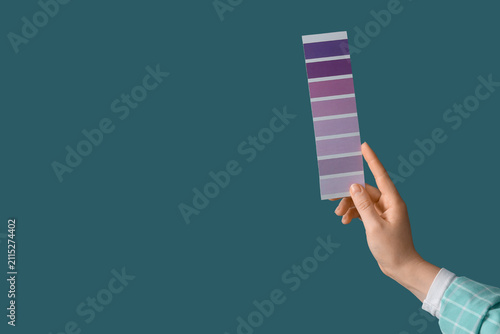Female hand with violet pai...