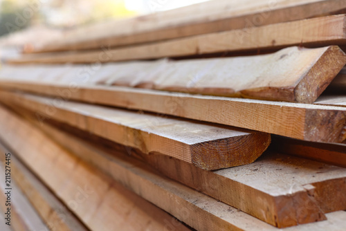 Картината върху платно Stacked wooden planks at sawmill, closeup