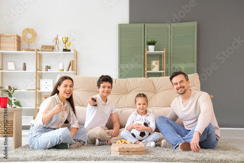 Happy family with soccer ba...