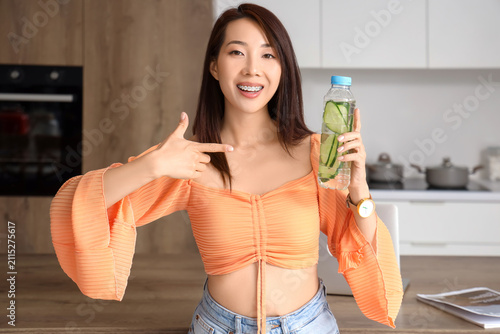 Young Asian woman pointing ...
