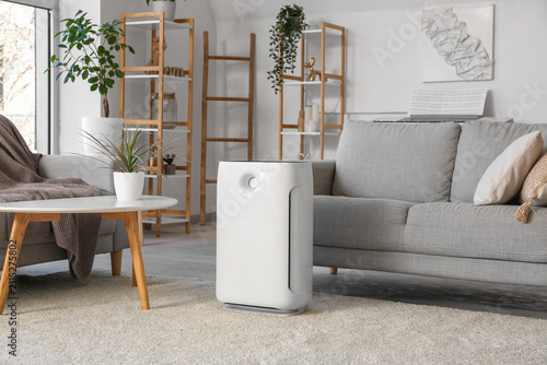 Modern humidifier near sofa...