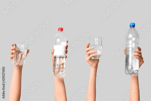 Female hands with bottles a...