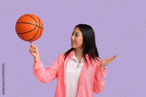 Sporty young Asian woman wi...