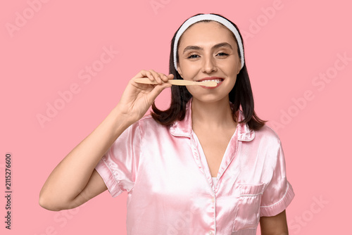 Young woman with toothbrush...