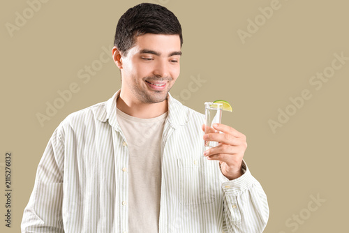 Young man with tequila shot...