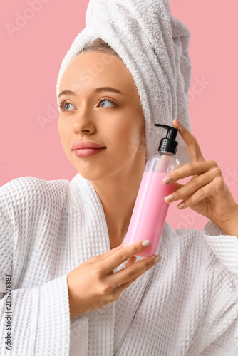 Young woman in bathrobe and...