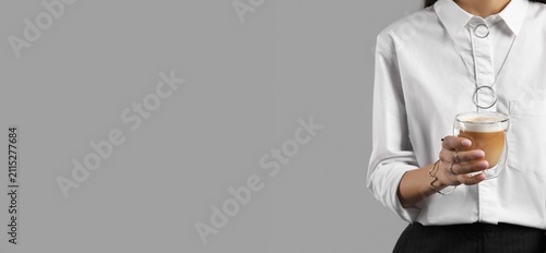 Woman in white shirt holdin...