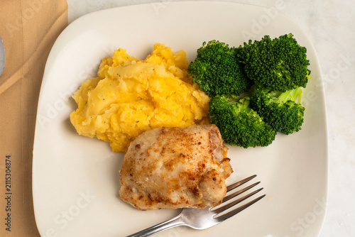   chicken thigh  with  chedder mash potatoes and broccoli