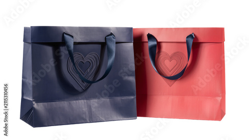Obraz na plátne Isolated duo of elegant gift bags, navy blue and coral red, with heart design an