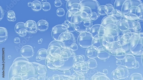 Soap bubbles float upwards against a blue background and pop. Bubbles underwater.