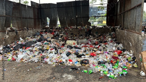Fotografie Pile of unsorted household garbage and plastic waste at a temporary waste collec