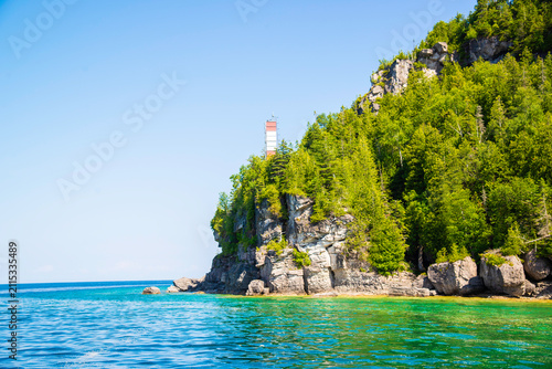 Timbermony, Canada - July 7 2026: Pristine shoreline of Flowerpot Island featuring rugged limestone cliffs, crystal-clear turquoise waters, and tranquil natural beauty along Georgian Bay