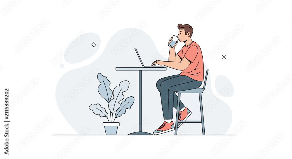 Fototapeta premium Young Man Drinking Water While Working on Laptop at a High Table in a Modern Cafe or Office Setting