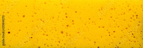 Quadro su tela Yellow synthetic sponge macro texture panoramic background