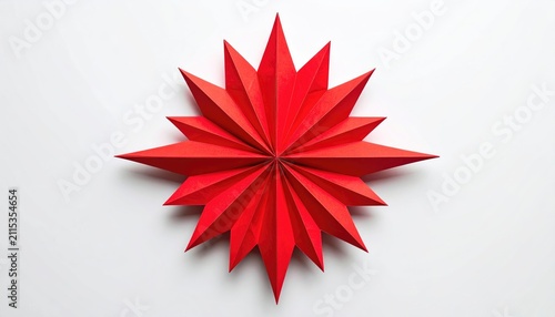 A vibrant red folded paper starburst on a white backdrop
