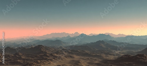 Serene Mountain Range Landscape at Sunset with Hazy Atmosphere.