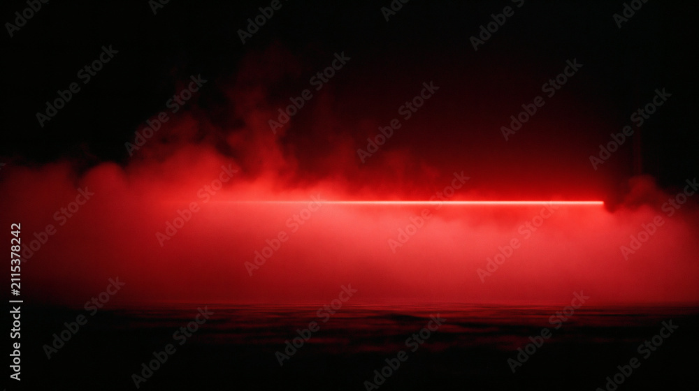 Obraz premium A bright horizontal red laser beam shines through a thick layer of dense red smoke against a dark background