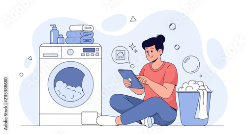 Person Using Tablet to Control Smart Washing Machine with Laundry Basket and Towels