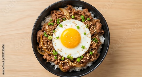 Japanese beef rice bowl topped with sunny side up egg and sesame seeds, japanese