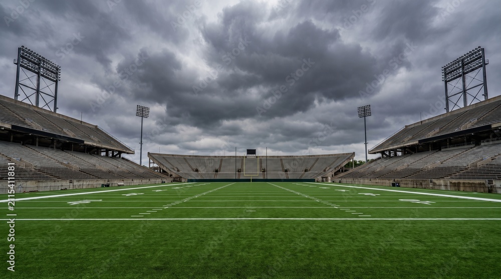Naklejka premium Empty American Football Stadium Under Dramatic Stormy Sky