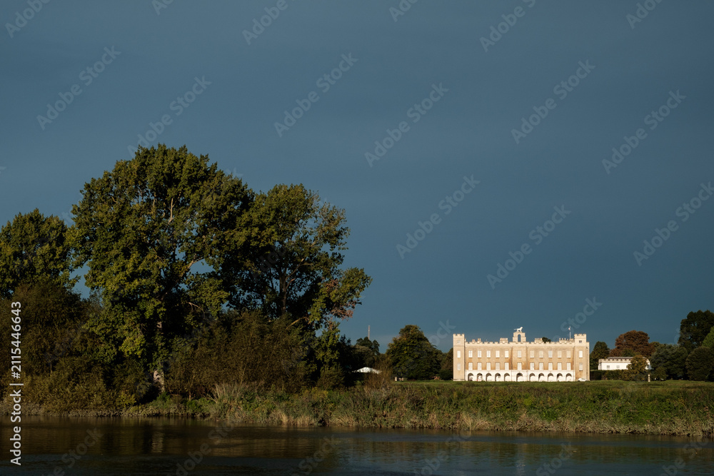Fototapeta premium Syon house estate by river thames under dramatic sky