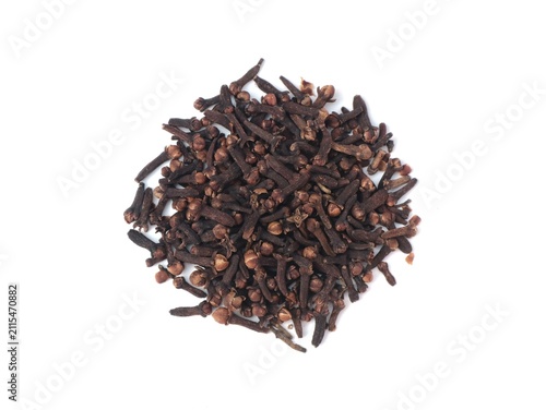 Top view of pile of whole dried cloves spice placed on a clean white background. Perfect visual representation for cooking ingredients, herbal medicine, aromatic spices, and culinary concepts
