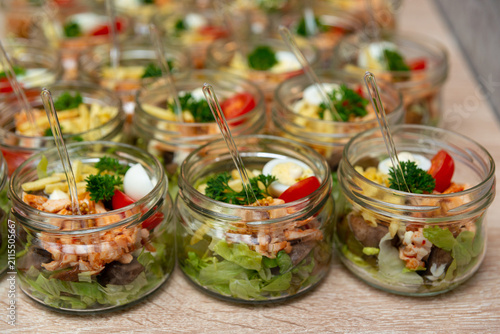 Картината върху платно Glass jars overflow with colorful salads