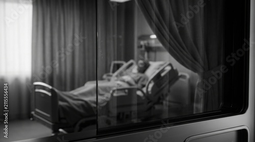 Hospital Room Scene With Patient Behind Glass