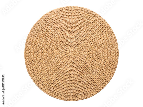 Natural jute placemat on white background, round woven straw table mat, rustic braided seagrass coaster for eco-friendly home decor