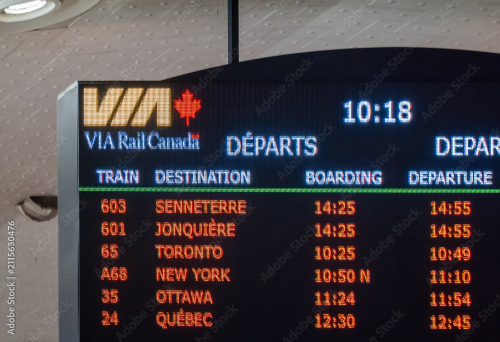 Fototapeta premium Montreal, Quebec, Canada. July 27, 2026. Close up shot of VIA Rail Canada digital departure board showing train schedules.