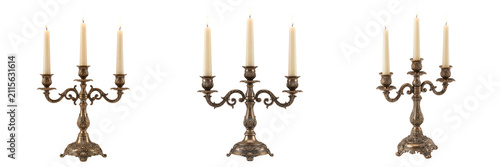 Three ornate vintage brass candelabras with candles isolated on transparent background