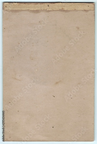 Worn, blank, beige paper with visible texture and subtle creases. Discoloration and slight marks suggest age and use