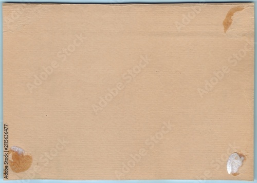 Aged, brownish paper with visible stains at the corners, showcasing texture and imperfections suggestive of its years.