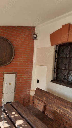 Exterior renovation progress showing brickwork and wooden doors