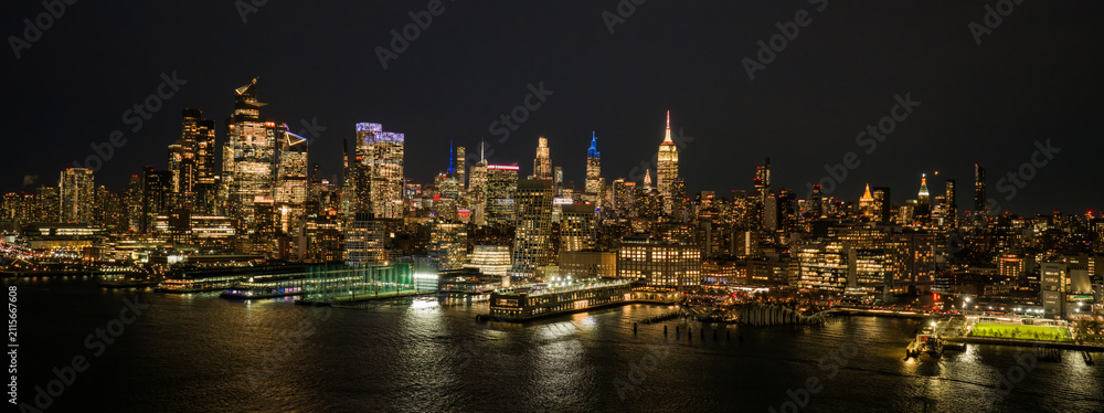 Fototapeta premium New York City panoramic skyline. NYC aerial skyline over downtown Manhattan. NewYork night skyline. New York skyline with Tower. NYC cityscape. New York waterfront. New York aerial view.
