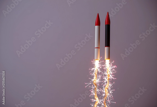 Two toy rockets launching w...