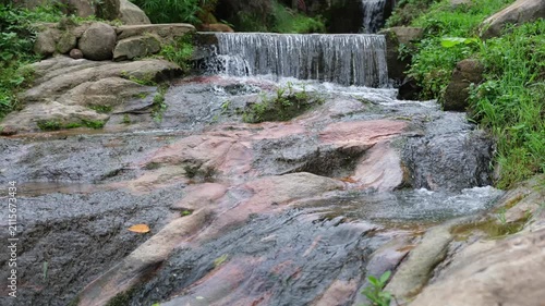 River flowing through the waterfall in the forest