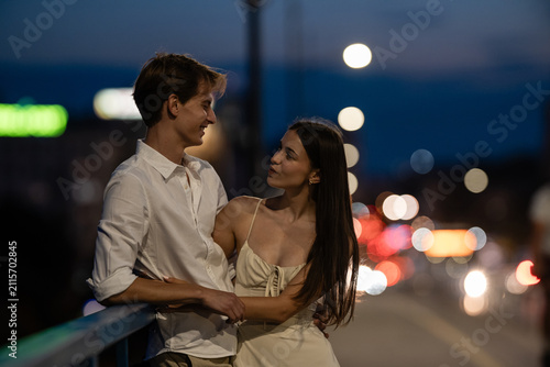 Bild auf Leinwand Young couple enjoying romantic city night date