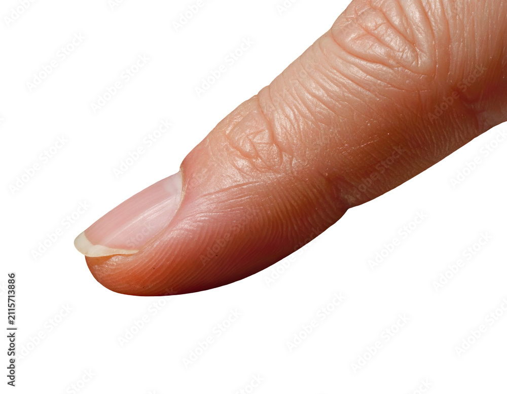 Fototapeta premium Close up of a human thumb showing clean fingernail against a solid black background