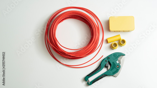 Fotografía Top view electrical junction box and red roll electrical wire isolated on white background