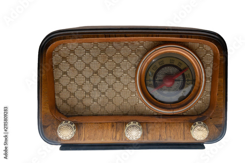 Vintage wooden radio receiver with tuning dial and speaker grille isolated on white background.