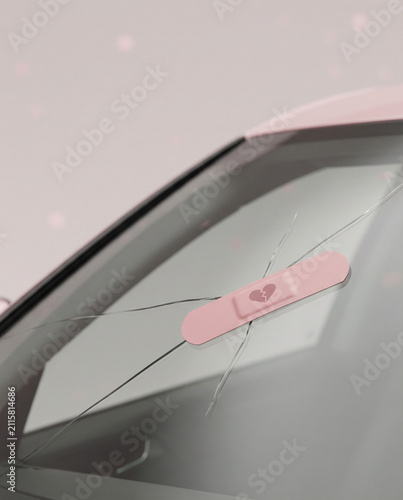 Pink Heart Bandage Applied to a Cracked Car Windshield
